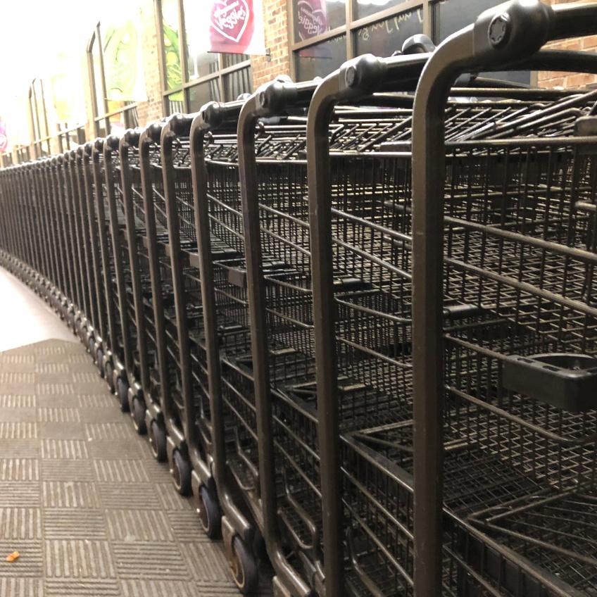 A row of wire shopping carts